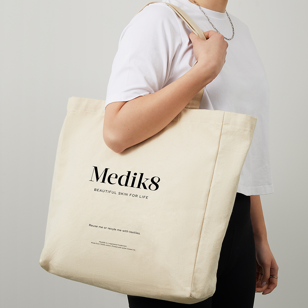 Medik8 cotton tote bag in a white background